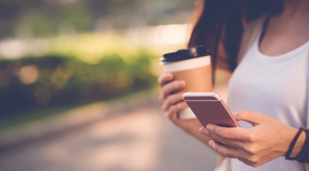 Woman on mobile phone texting.