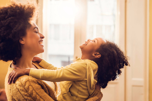 Young mother laughing with child