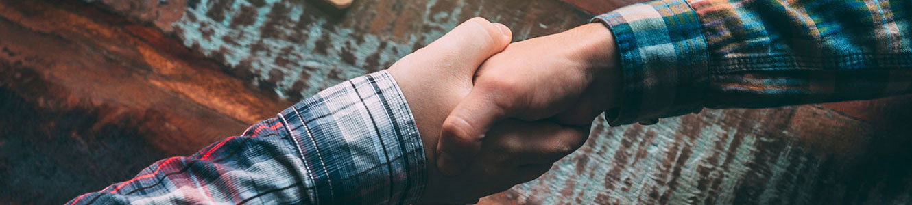 Men shaking hands in casual clothes