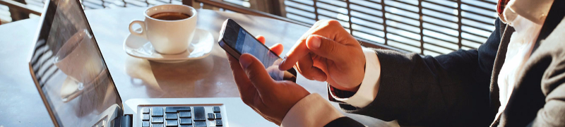 Man with laptop and mobile phone