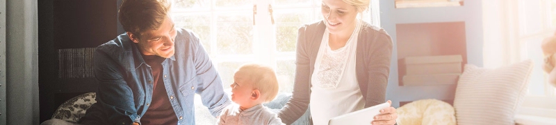 Family with toddler sitting on window seat