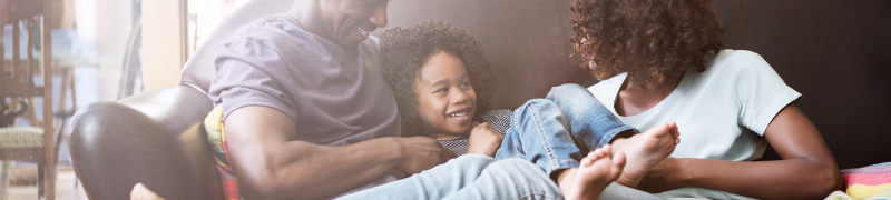 family barefoot on couch