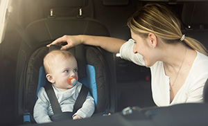Mother and infant in car