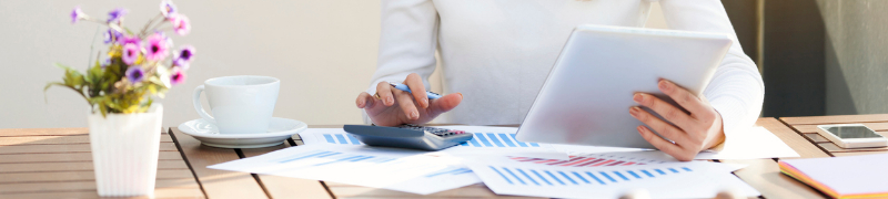 Woman using calculator for finances