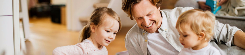 Family with children looking at tablet