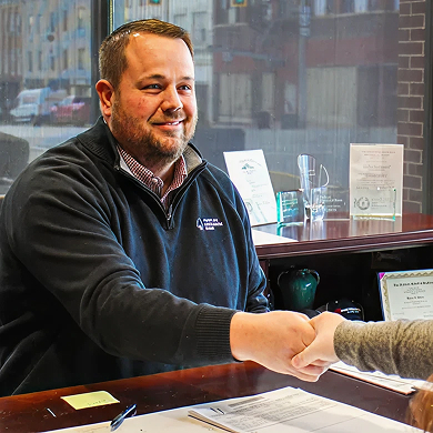 Peoples Exchange Bank Employee helping a customer with an Agricultural Loan
