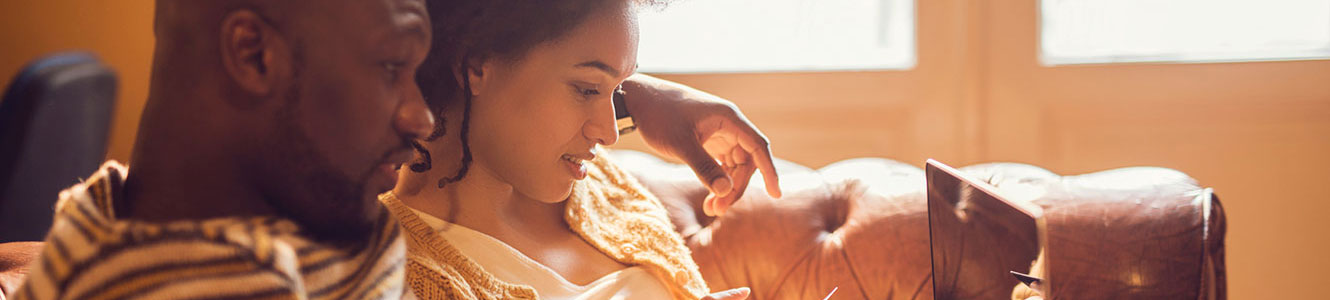 Couple at home on computer