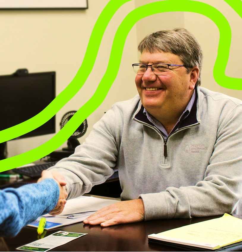 Peoples Exchange Bank Employee greeting a customer