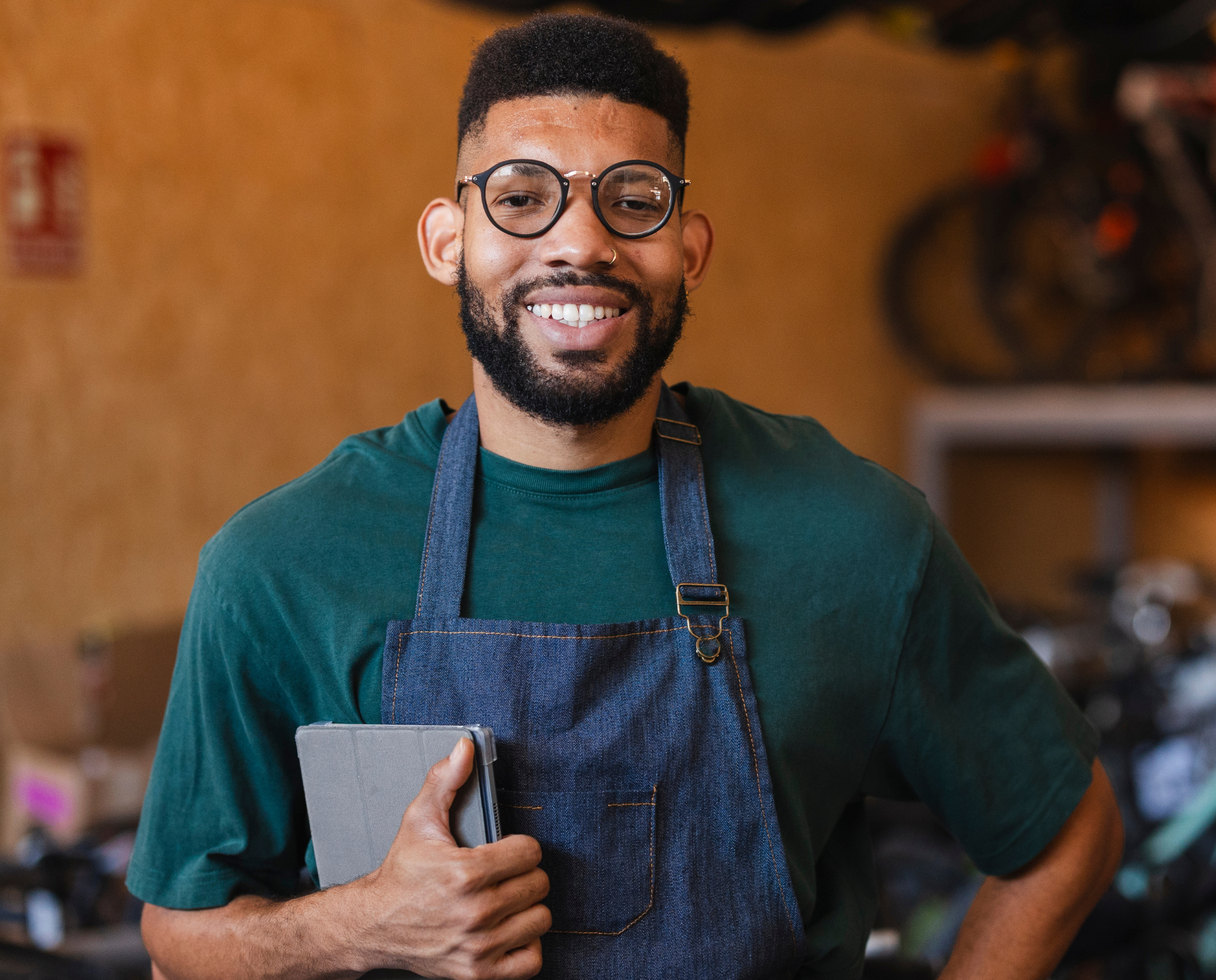 Small Business owner smiling in their storefront 