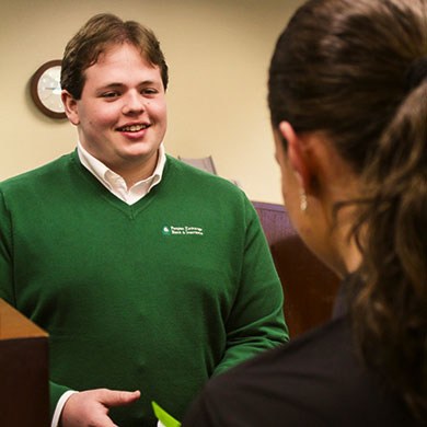 Peoples Exchange Bank Employee advising a customer on business endeavors