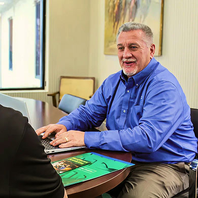 Peoples Exchange Bank Employee helping a customer with a Business Loan