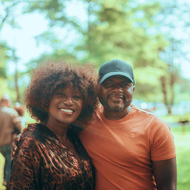 Couple smiling outside