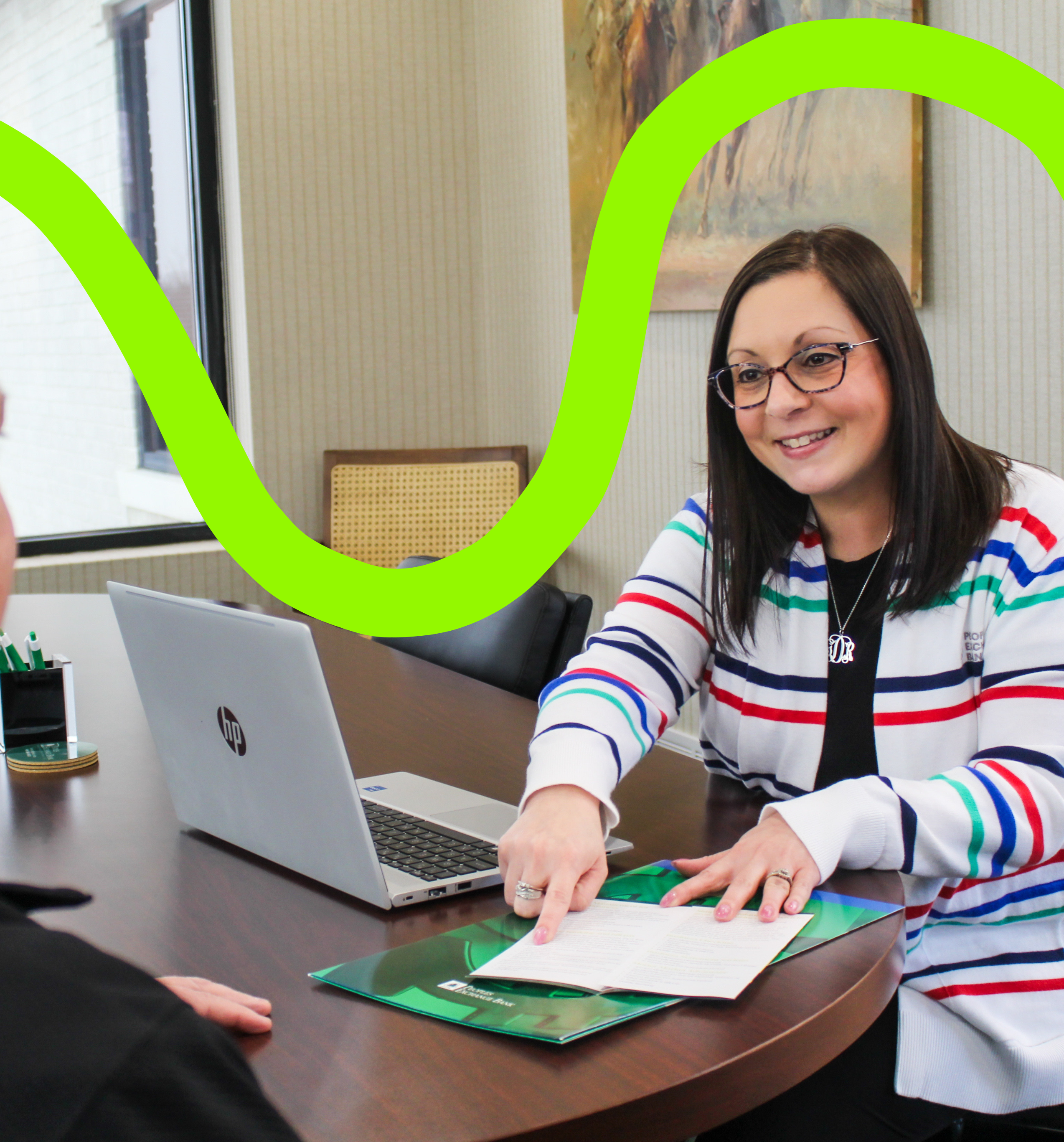 PEB employee smiling while helping a customer