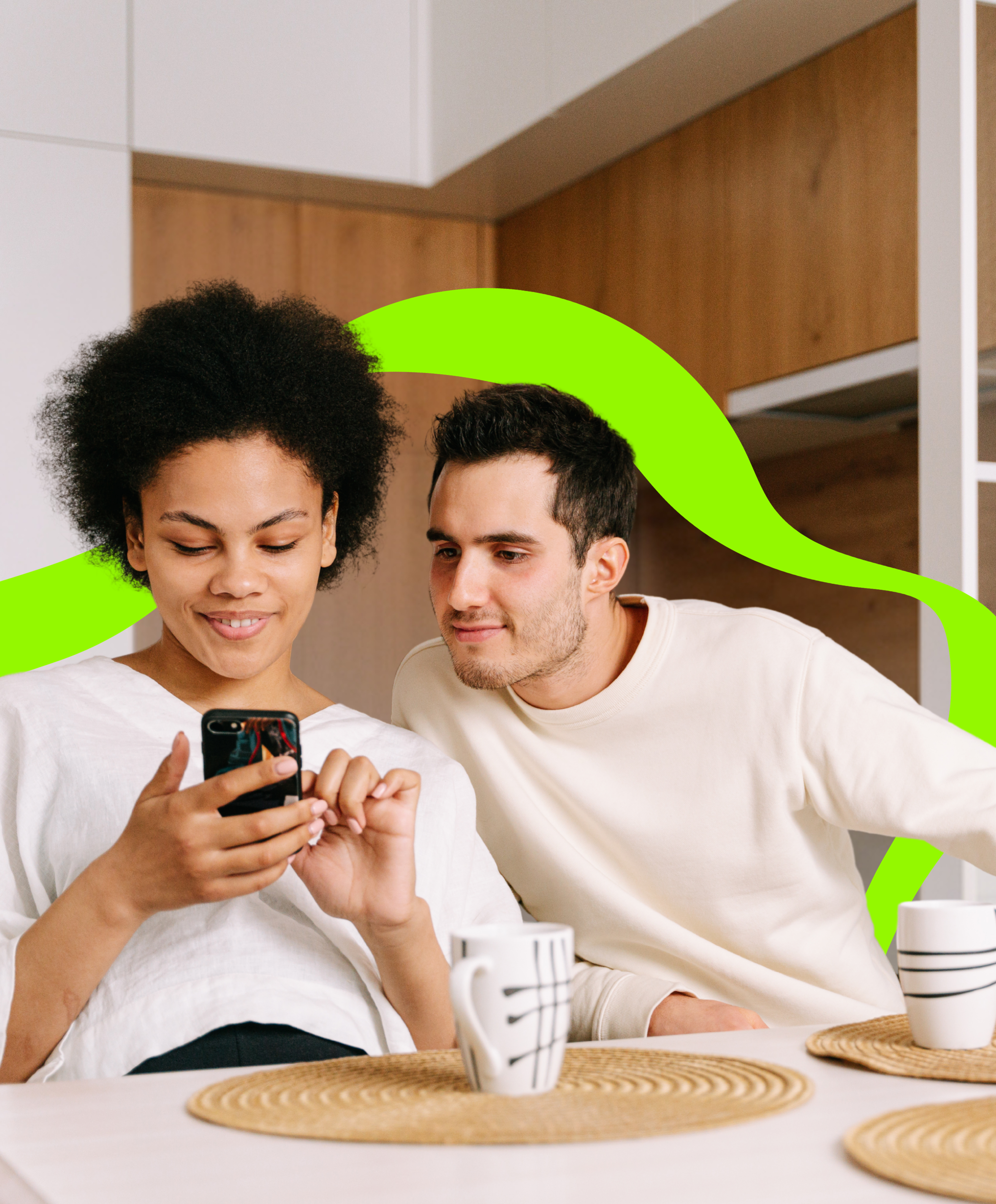 Couple looking at phone in their home 