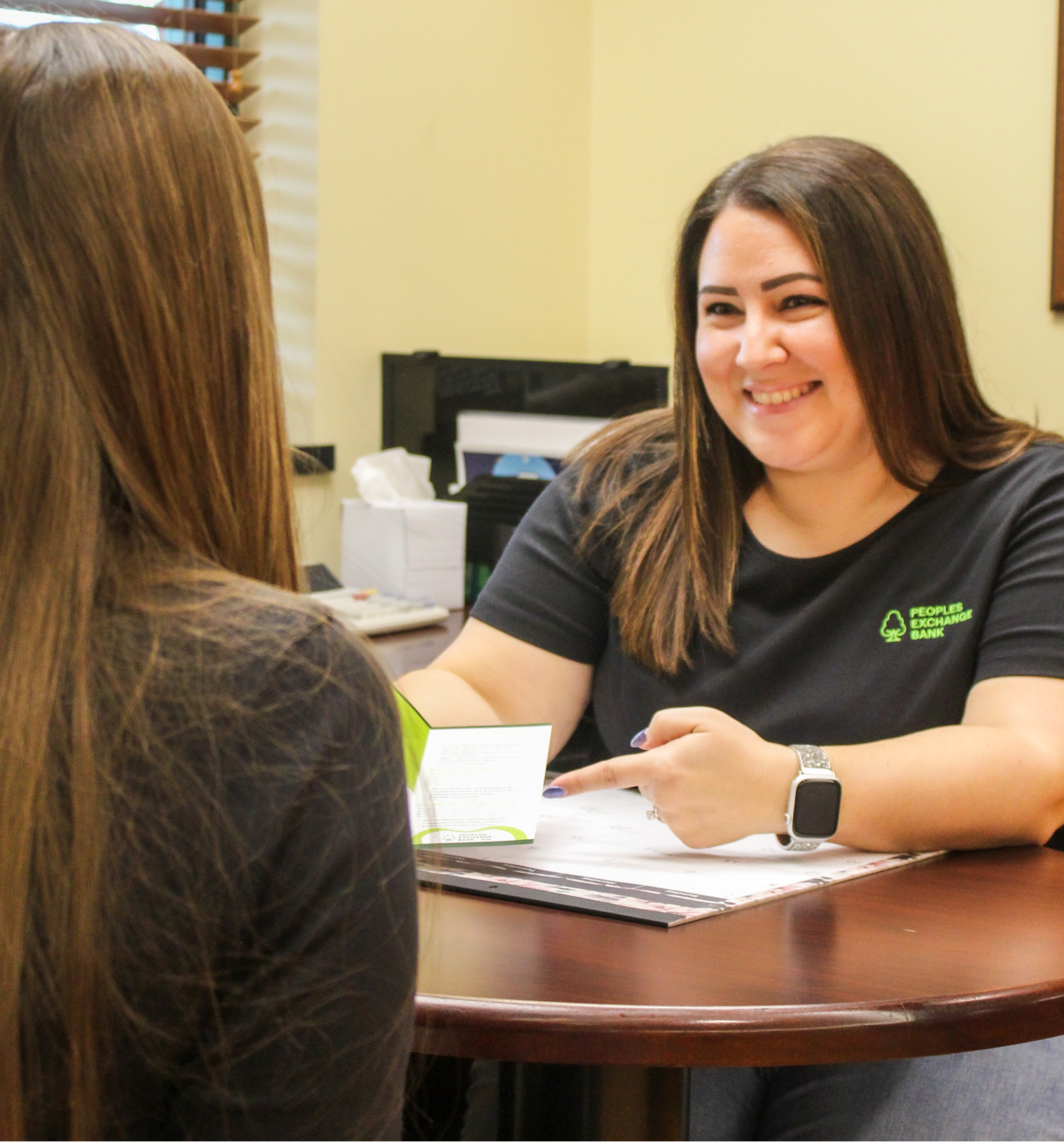 PEB employee talking with customer
