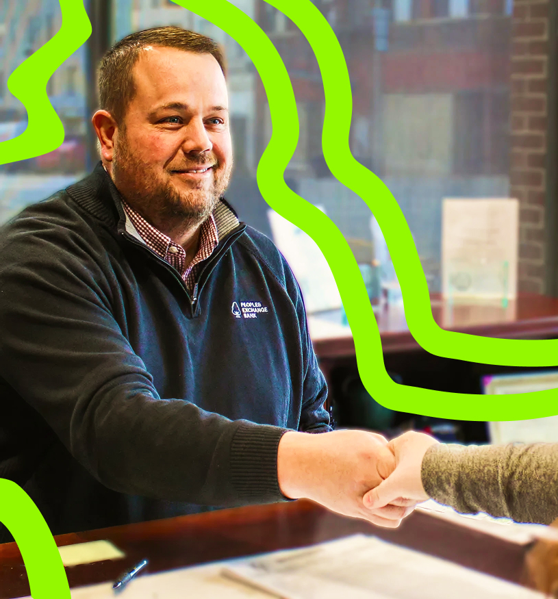 Peoples Exchange Bank Employee meeting with a customer about a Small Business Loan