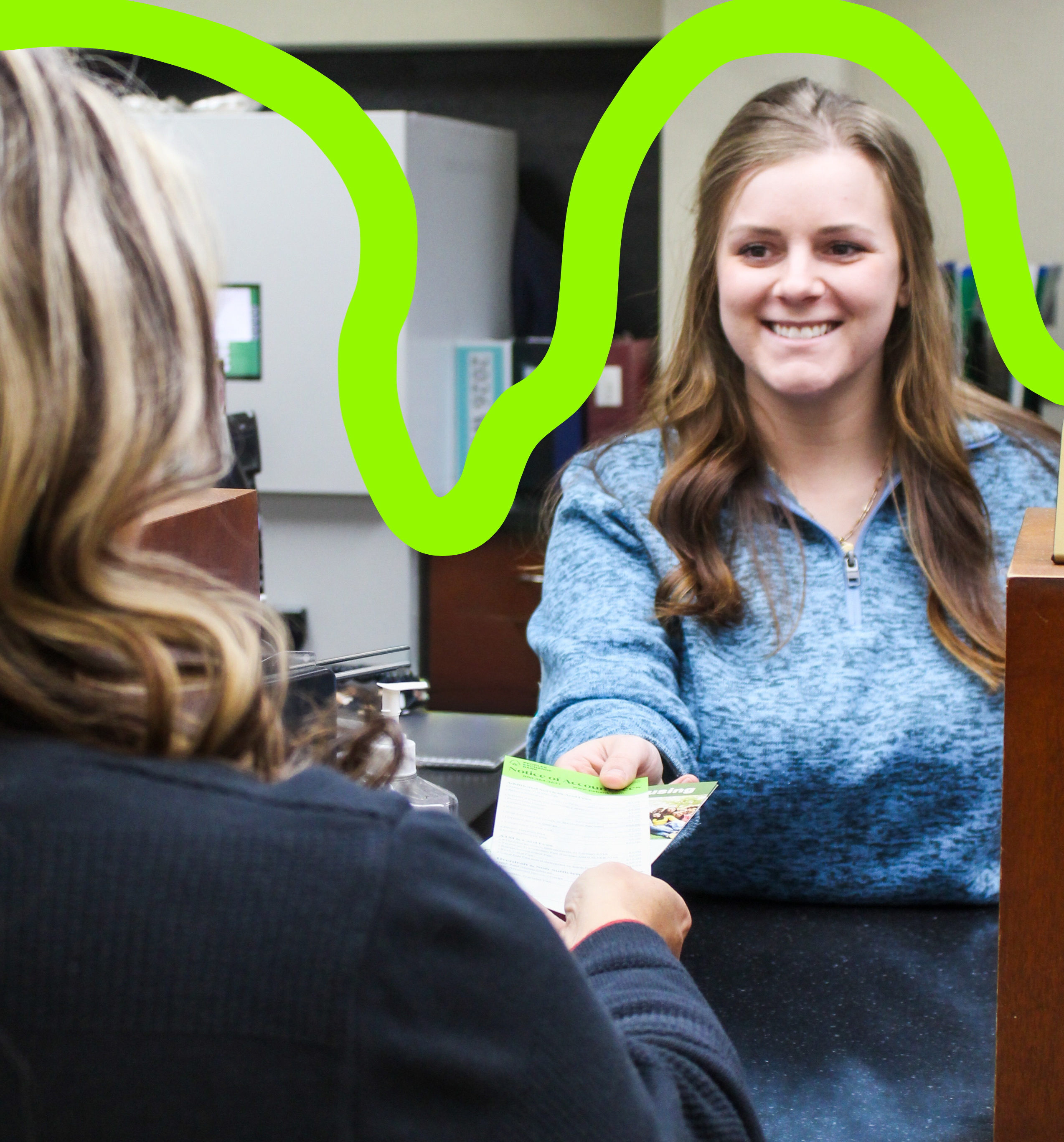 Peoples Exchange Bank employee handing customer Notice of Account Fees brochure.