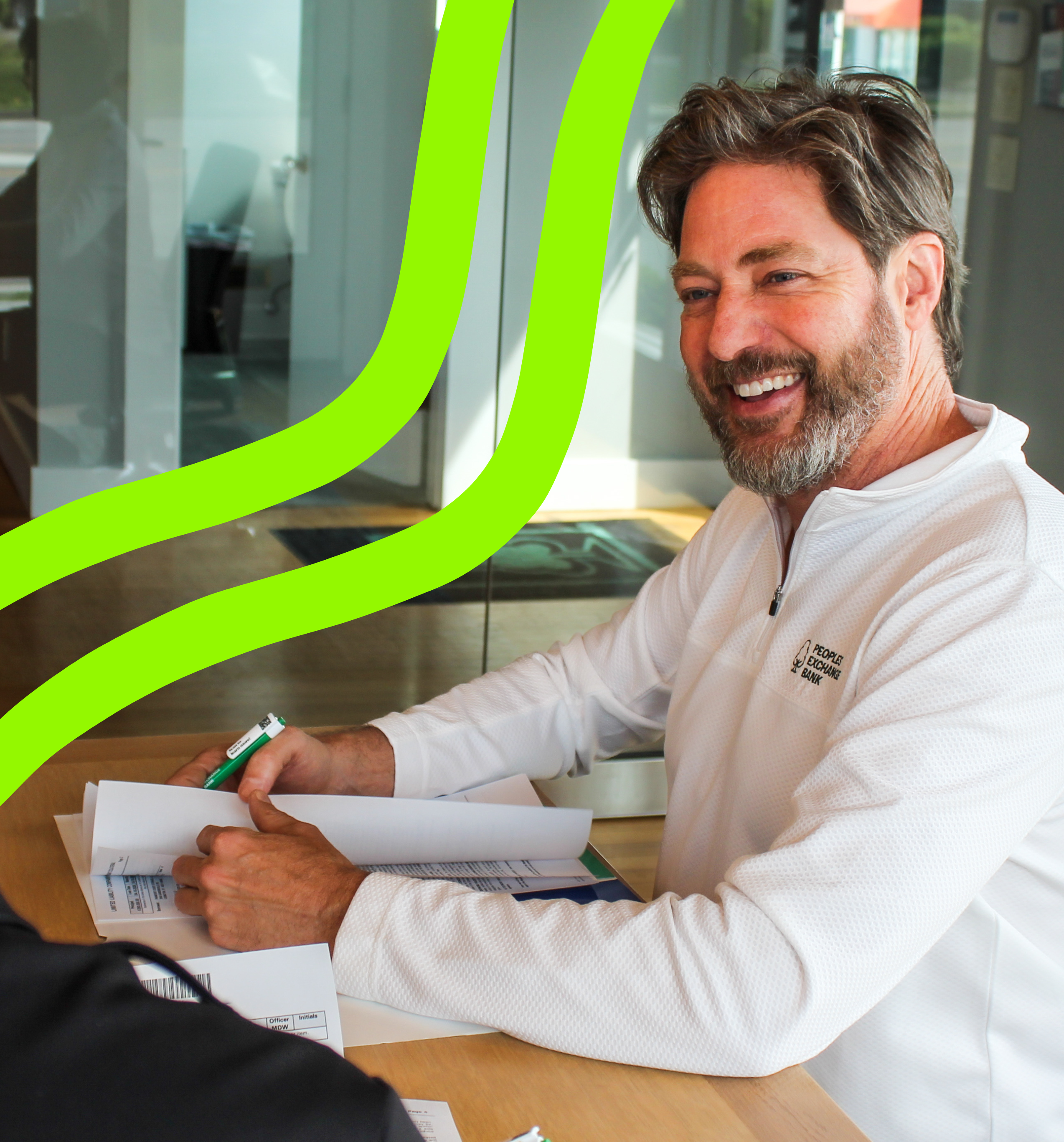 Matt, a Peoples Exchange Bank employee, at desk working
