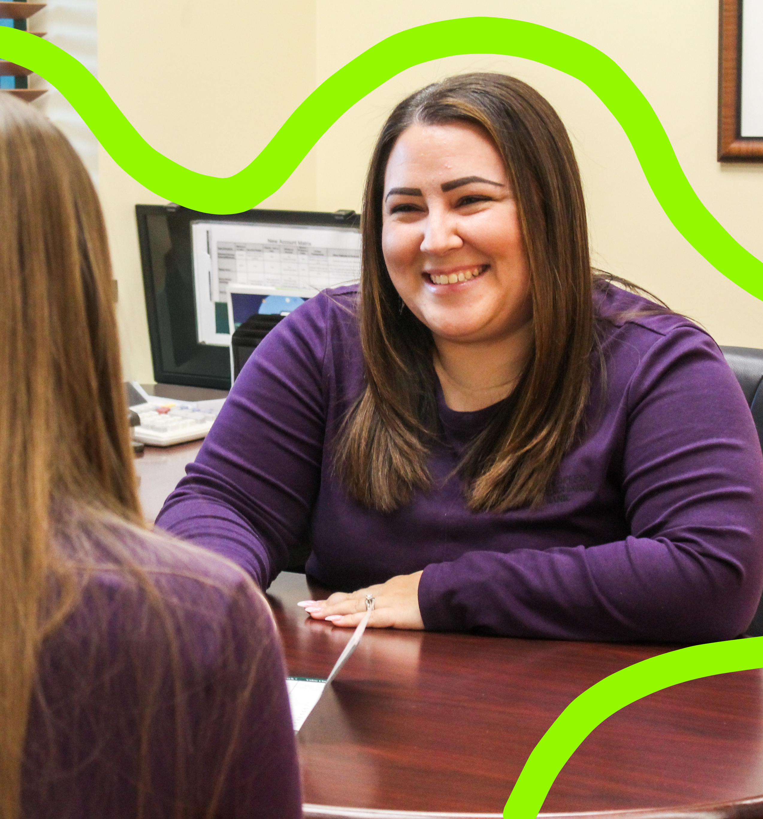 PEB employee smiling while helping a customer